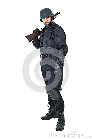 Swat Agent Wearing A Bulletproof Vest And Aiming With A Gun