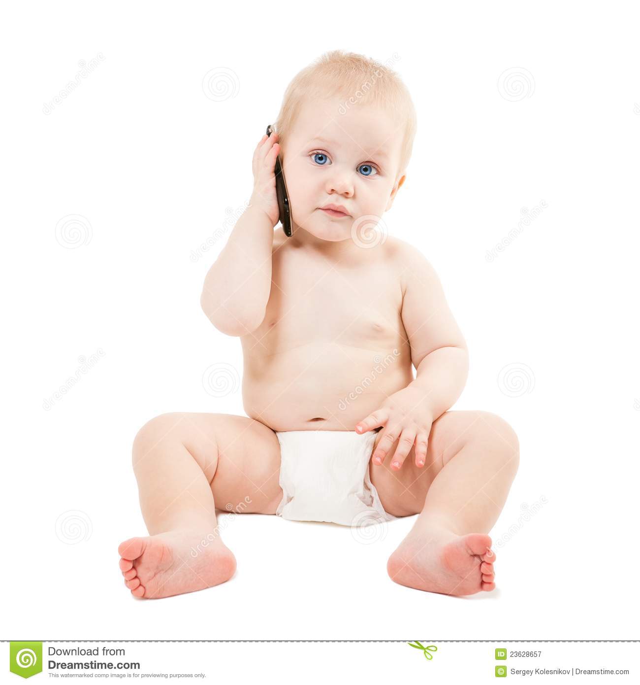 Cute Baby Boy Is Talking On Cell Phone Royalty Free Stock Photography