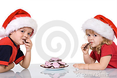 Kids With Santa Hats Eating Cookies Royalty Free Stock Photo   Image