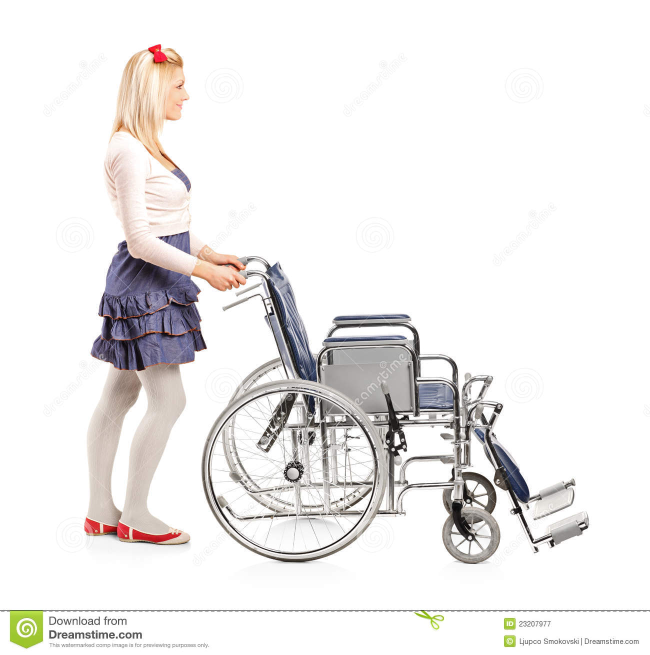 Portrait Of A Young Girl Pushing Wheelchair On White Background