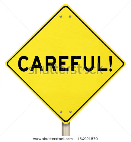 The Word Careful On A Yellow Road Sign To Warn You To Be Safe From