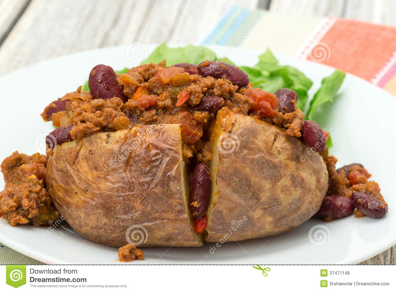 Baked Potato Filled With Spicy Chili Con Carne   Studio Shot 
