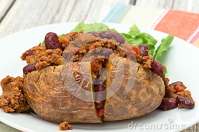 Baked Potato Filled With Spicy Chili Con Carne   Studio Shot