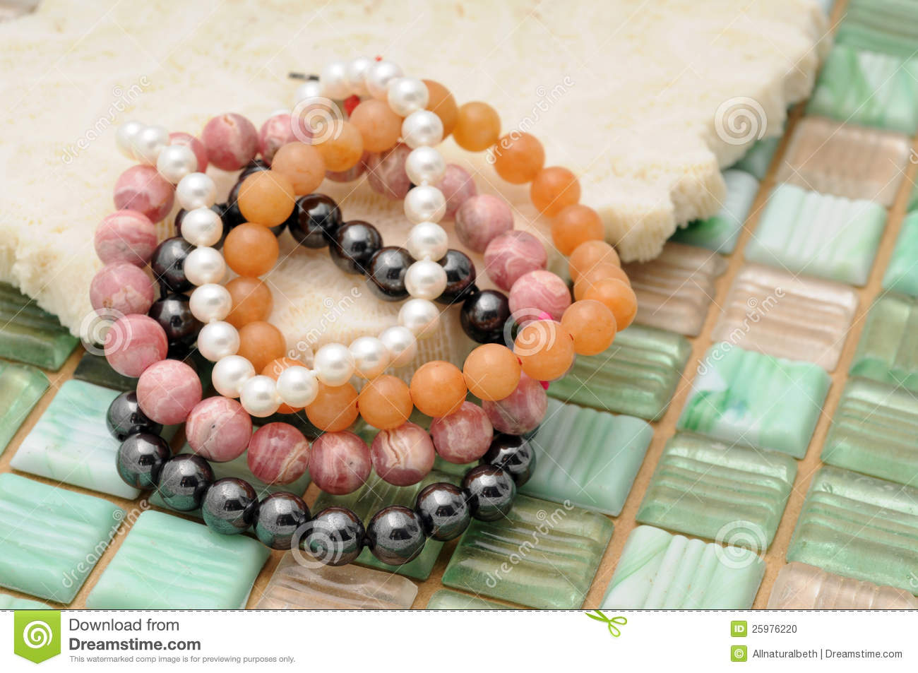 Beaded Colorful Fashion Bracelets On Coral And Tile Background