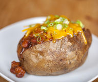 Loaded Baked Potato With Chili And Cheese Royalty Free Stock Photos