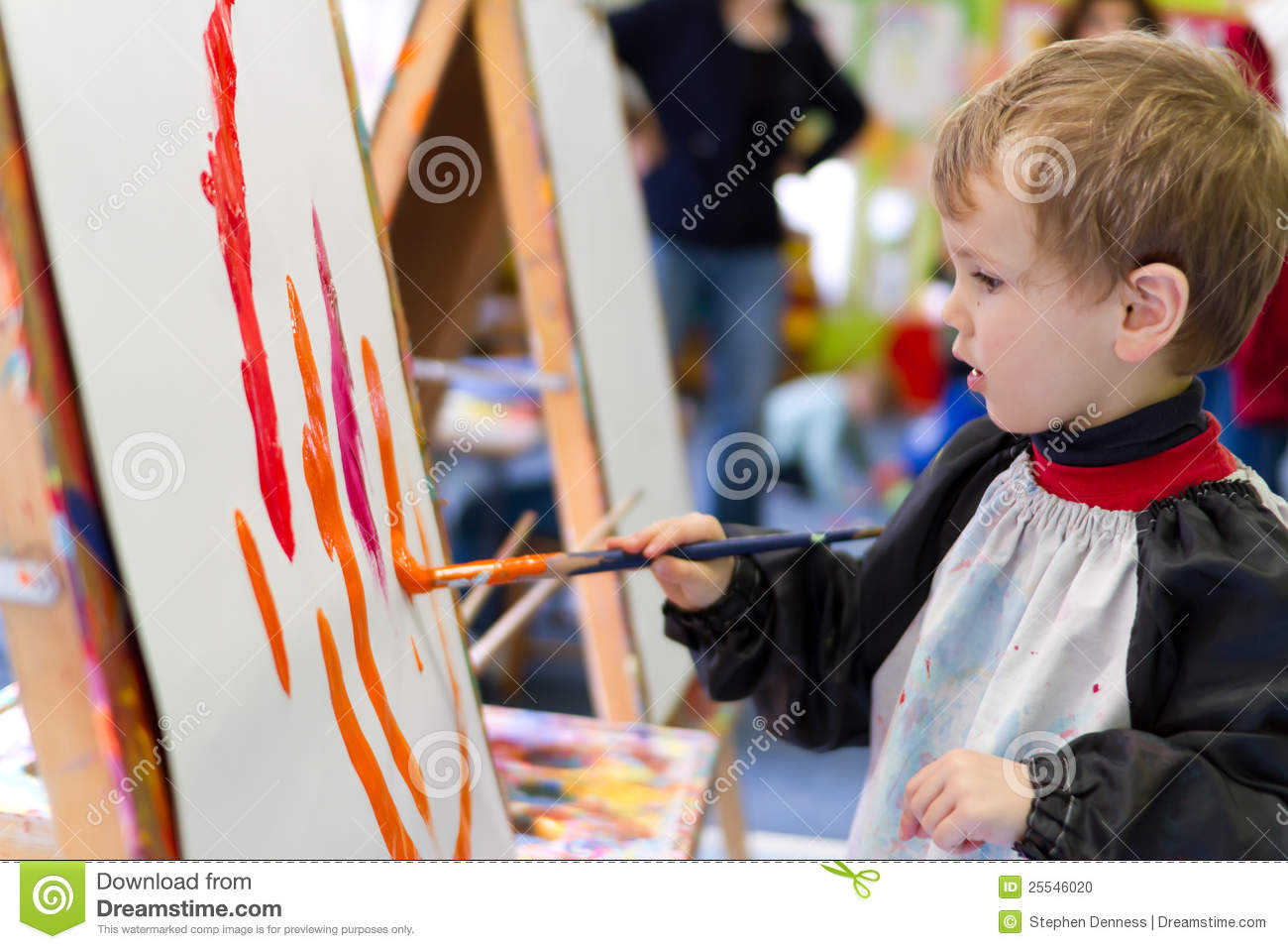 Preschool Boy Painting With Colourful Paint At Preschool
