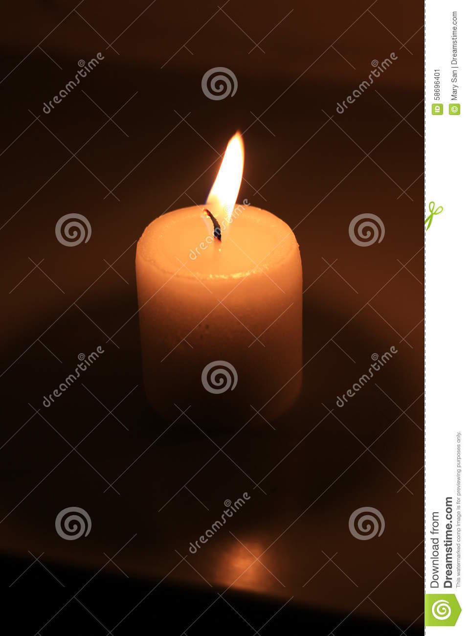 Holiday Candle Burning On A White Background And Reflected