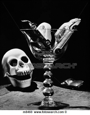 Still Life Concept Of Drunk Driving Toy Cars In Cocktail Glass Beside