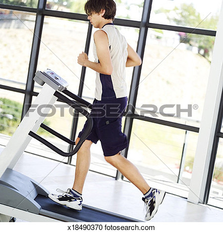 Stock Photography   Portrait Of A Young Man Running On A Treadmill