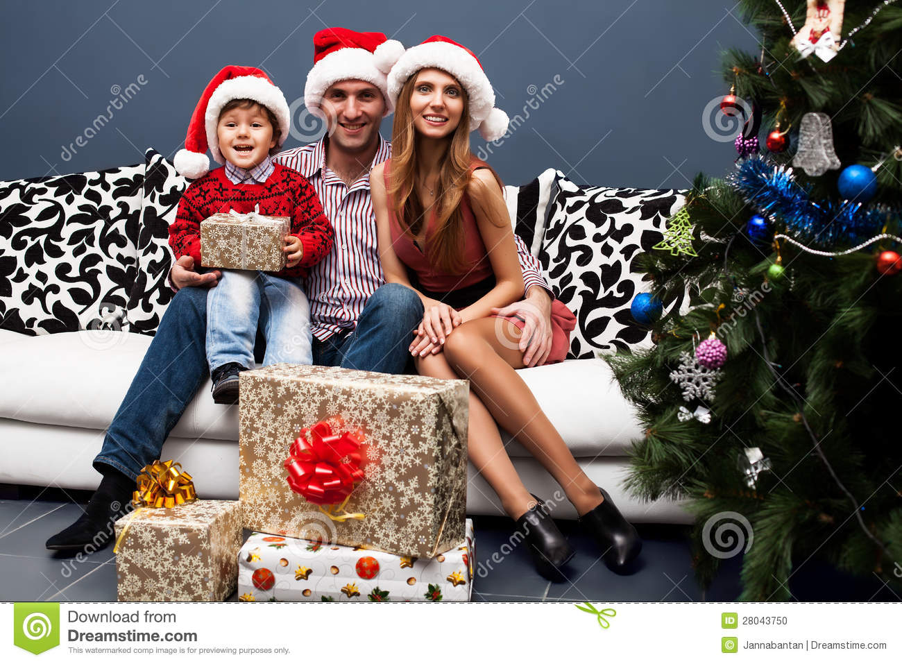 Portrait Of A Happy Family Spending Christmas Time At Home With Their
