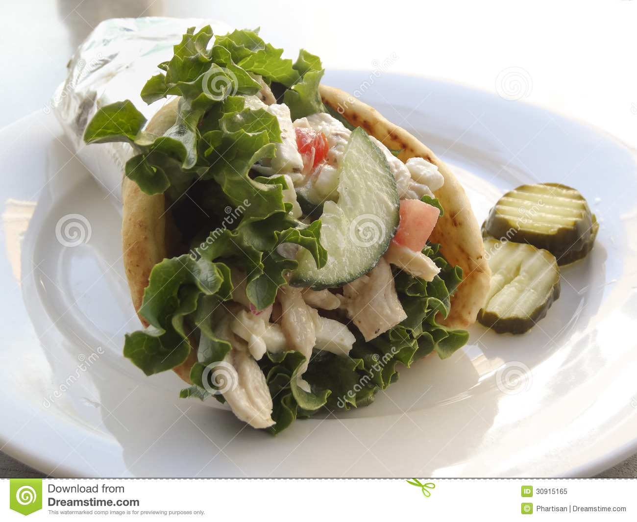 Chicken Pita Greek Style Gyro Sandwich Served In Silver Foil On Plate 