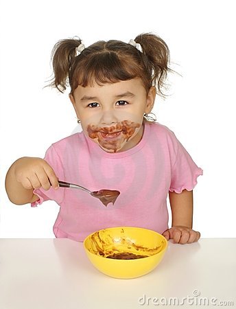 Girl Eating Chocolate Pudding With A Messy Face Isolated On White