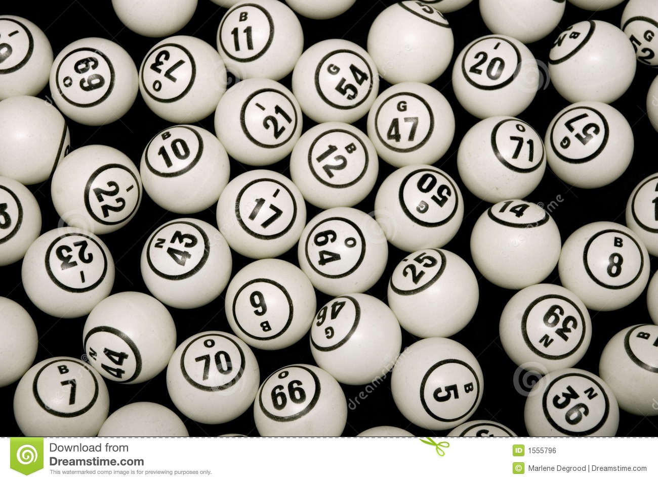 Black And White Numbered Bingo Balls On A Black Background