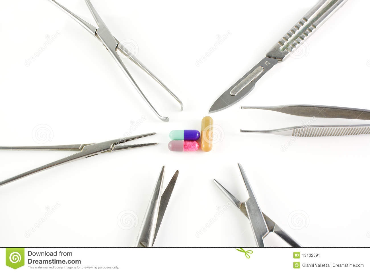 Surgical Medical Instruments And Capsules Over White Background