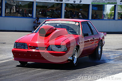 Side View Of Red Mustang Drag Car During Burnout At Head Up Challenge