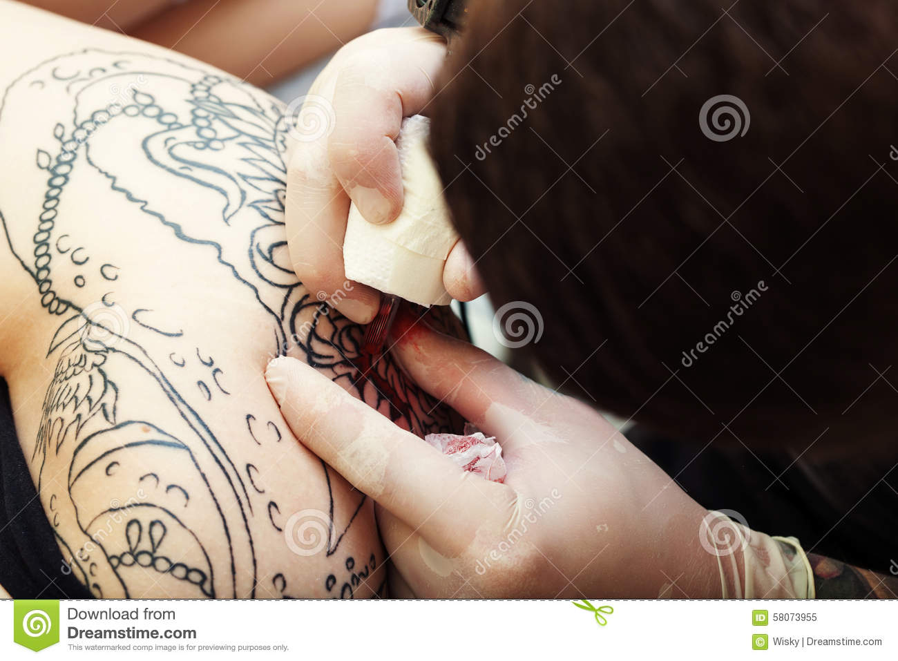 Stock Photo  Professional Tattoo Artist At Work