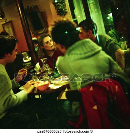 Stock Photo Of Group Of Young People Eating In Restaurant Paa070000023    