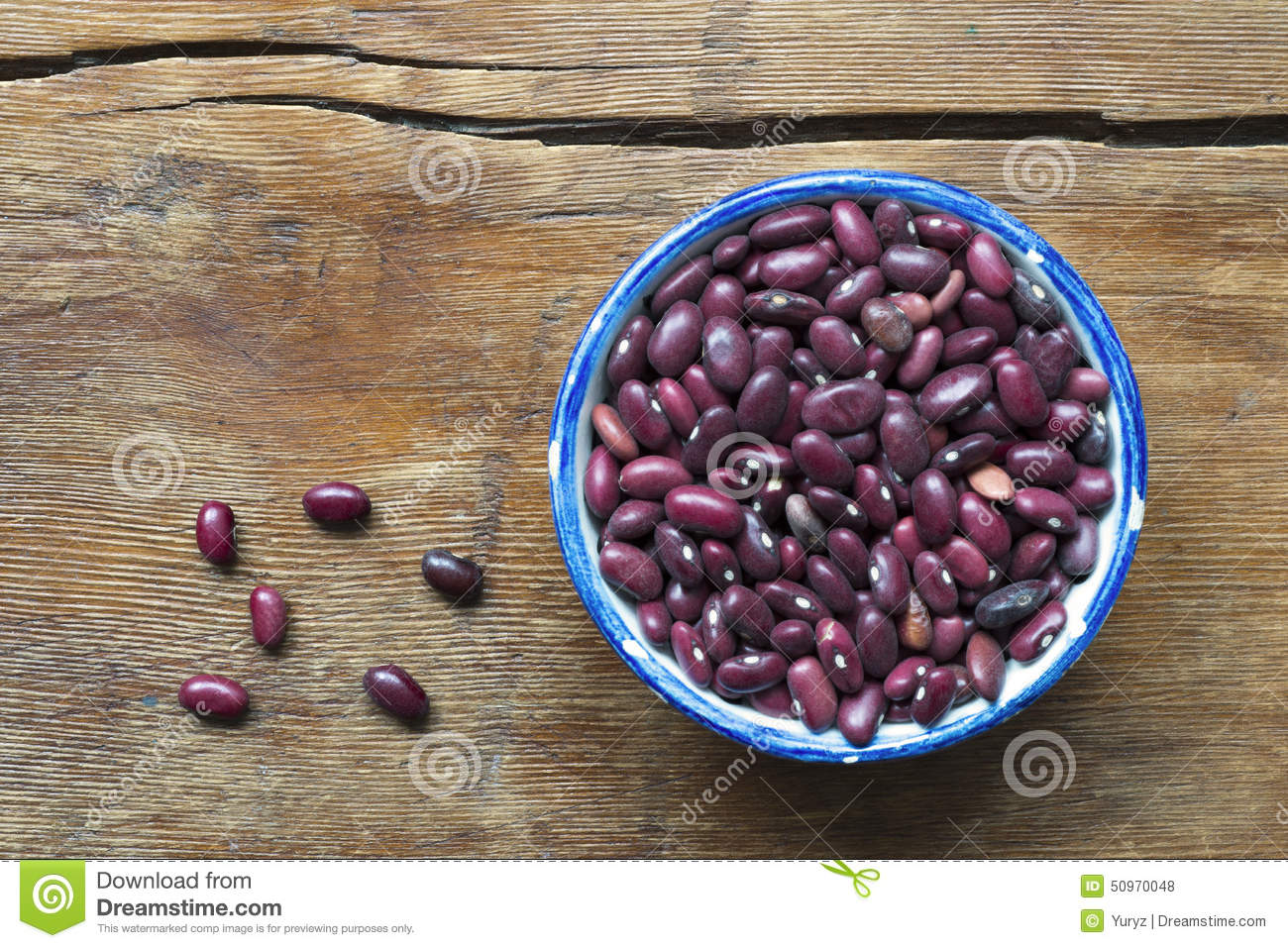 Many Red Kidney Beans In Small Blue Cup On Vintage Wooden Table