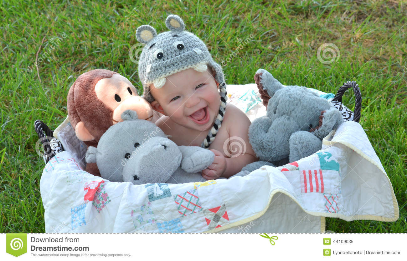 Baby Boy In Basket Of Stuffed Animals Stock Photo   Image  44109035
