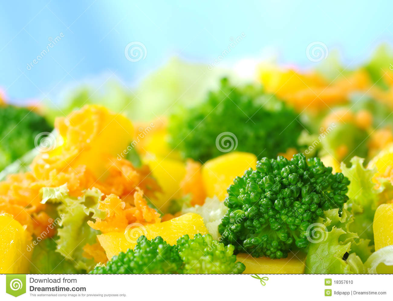 Fresh Salad Made Of Broccoli Mango Carrot And Lettuce In Front Of A