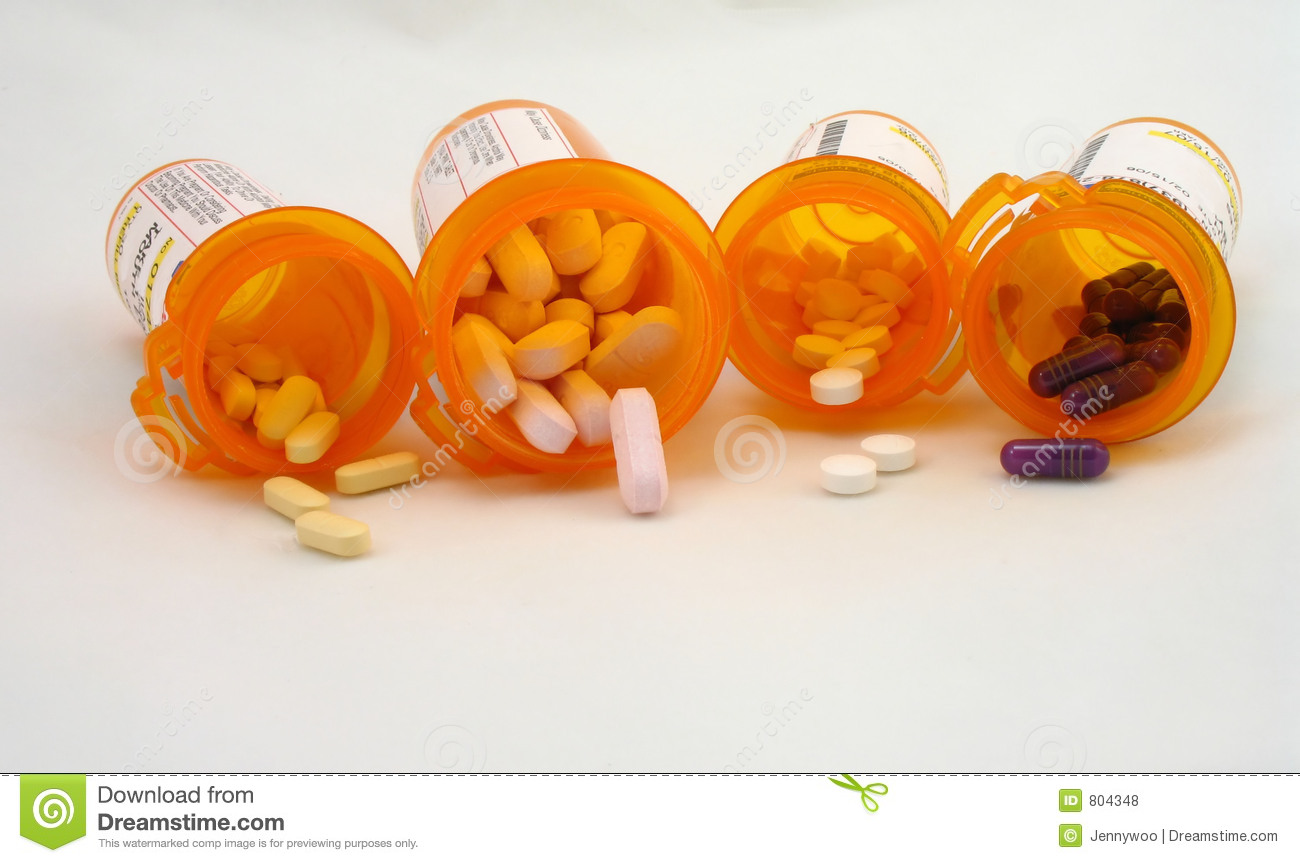 Several Prescription Bottles With Medicine Inside 