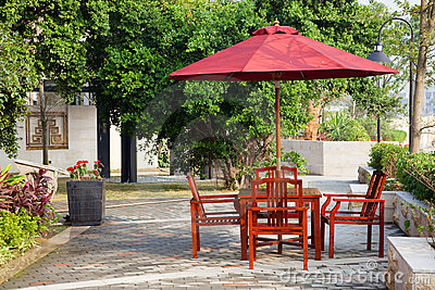 Summer Patio With Tables And Wooden Chairs Royalty Free Stock Photo