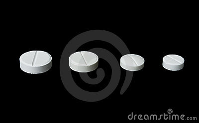 Four White Pills Of Different Size Royalty Free Stock Photos   Image