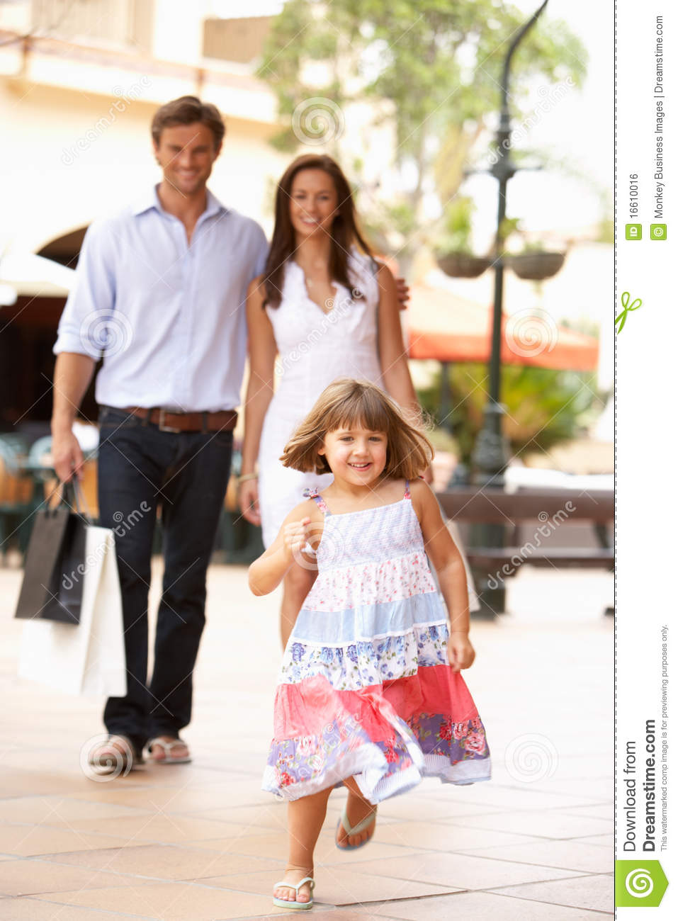 Young Family Enjoying Shopping Trip Royalty Free Stock Image   Image    