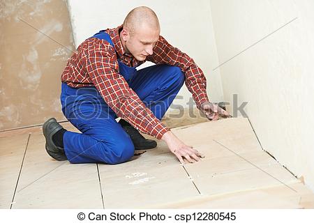 Stock Photo   Tiler At Home Floor Tiling Renovation Work   Stock Image