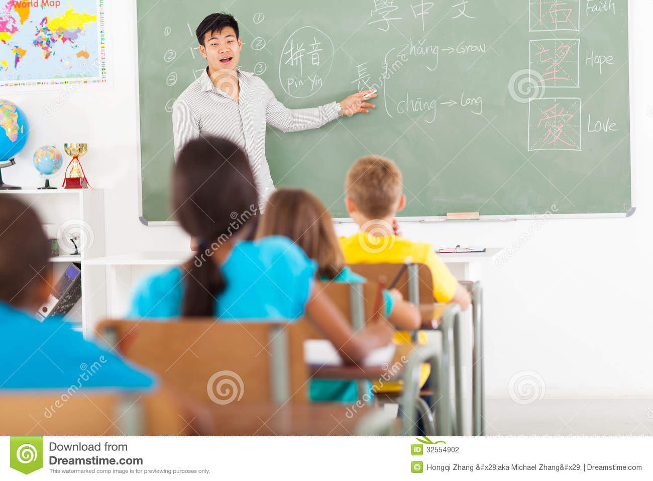 Elementary School Teacher Teaching Chinese Language In Classroom