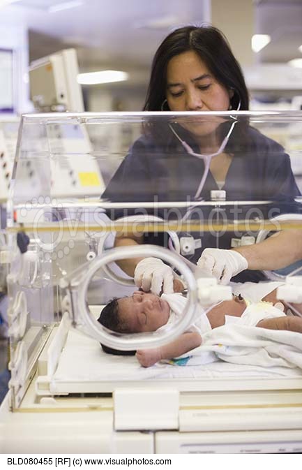 Nurse Helping Mother With Newborn Baby Stock Photo   Getty Images