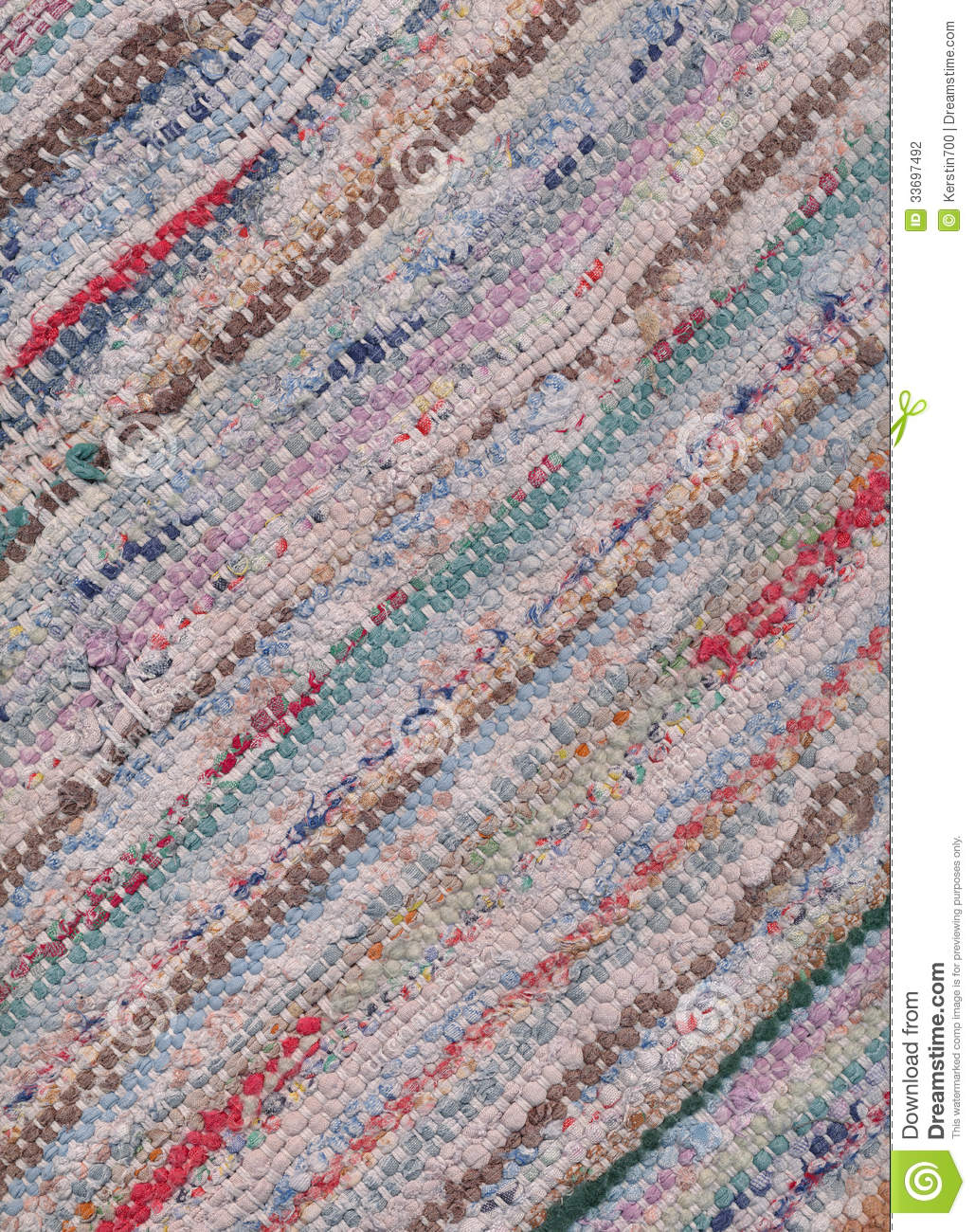 Diagonally Closeup Of Old Worn Out Striped Rag Rug