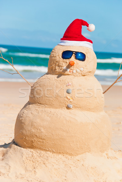 Stock Photo   Snowman Built Out Of Sand At The Beach  With Shells As