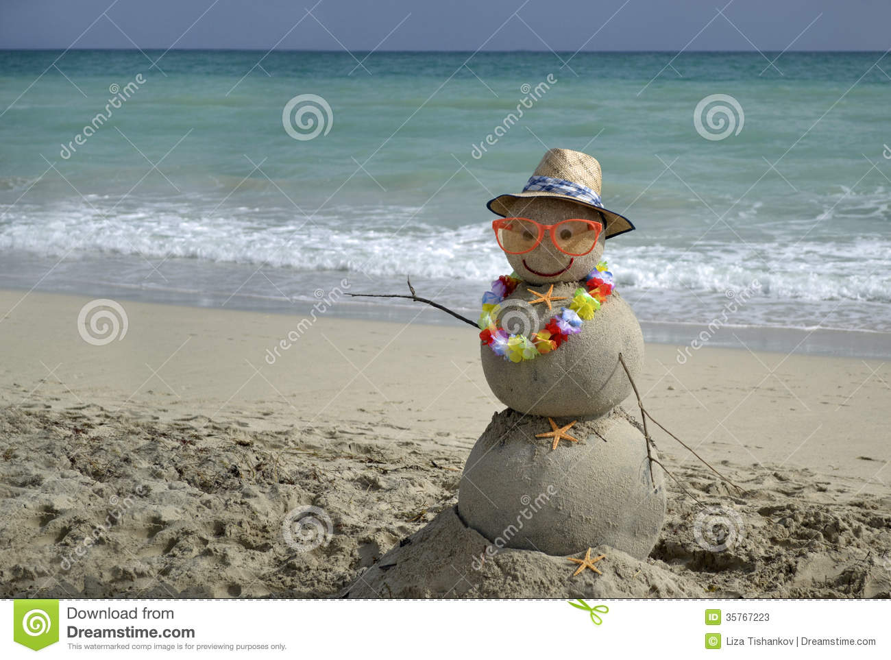 Winter Vacation  Snowman Made Of Sand On The Beach With Ocean    