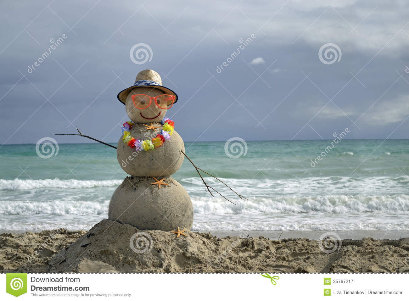 Winter Vacation  Snowman Made Of Sand On The Beach With Ocean    
