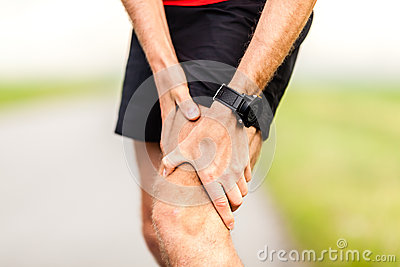 Holding Sore Leg Knee Pain From Running Or Exercising Jogging Injury
