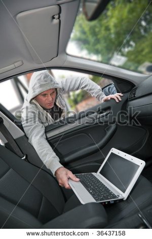 Car Theft   A Laptop Being Stolen Through The Window Of An Unoccupied