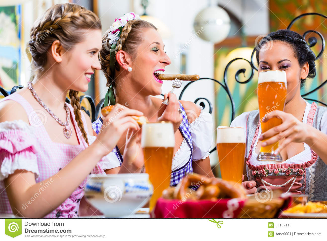 Three Women Eating Lunch Or Dinner In Bavarian Restaurant 