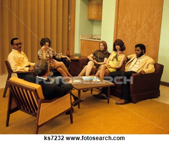 1960s 1970s Group Men Women Sitting At Coffee Table Meeting Group View    