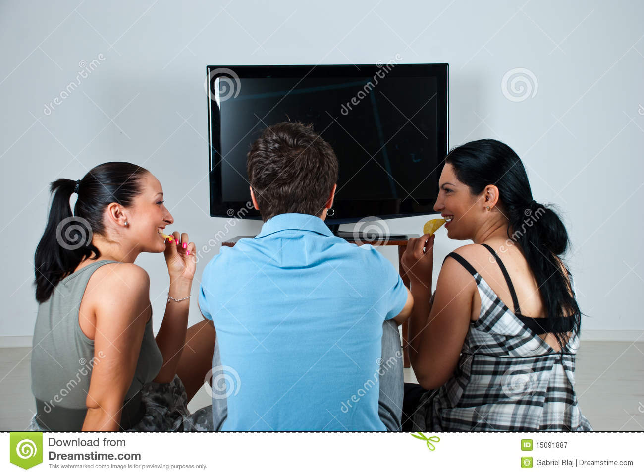 Friends Having A Funny Conversation While Watching Soccer Game At Tv
