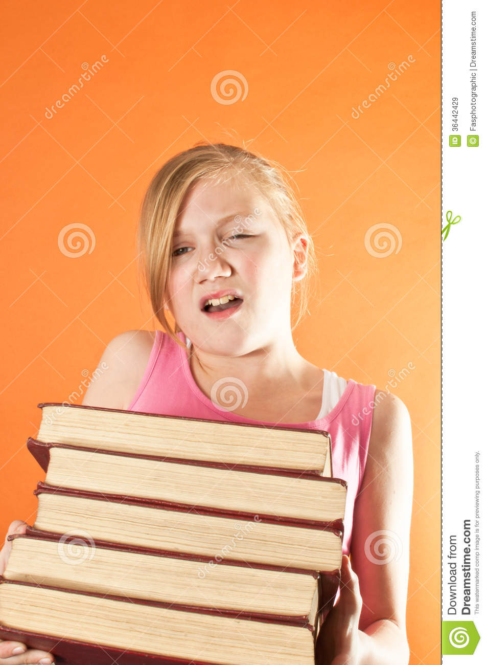 Student Struggling With A Stack Of Books Royalty Free Stock Images    