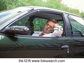 Man Asleep In His Car While Sitting In Rush Hour Traffic  View Large