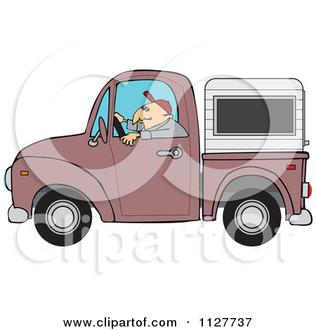 Man Driving A Pickup Truck With A Sleeper Or Canopy