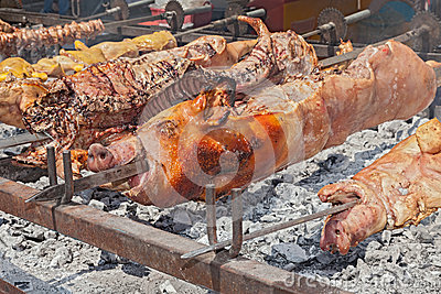 Spit Roasted A Whole Pigs Cooked Over Hot Coals   Gastronomic
