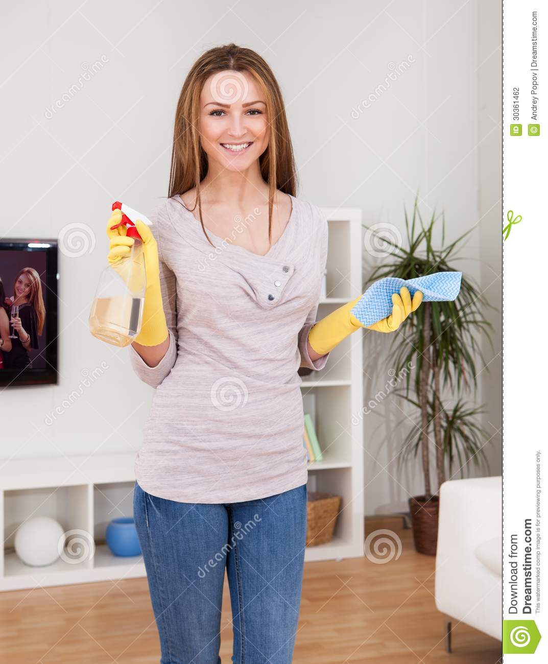 Portrait Of Young Woman Doing Household Chores