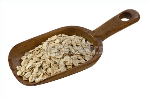Rolled Oats On A Rustic Wooden Scoop Isolated On White