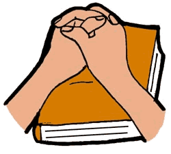 Hands Folded On Brown Book