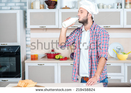 In The Kitchen And Milkman Smiling At The Camera   Stock Photo