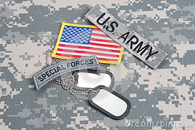 Us Army Special Forces Tab With Blank Dog Tags On Camouflage Uniform
