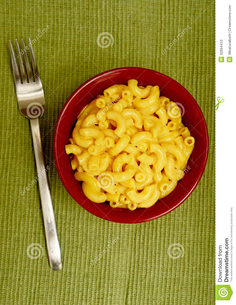 Mac And Cheese With Fork On Green Background For Lunch